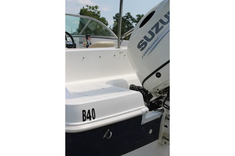 Slide: The Image of 2020 Hurricane SunDeck 187 OB boat with Suzuki outboard motor, side view. - 20