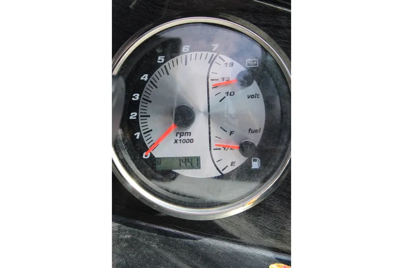 Slide: The Image of Close-up of a 2020 Hurricane SunDeck 187 OB dashboard gauge showing RPM and fuel levels. - 26
