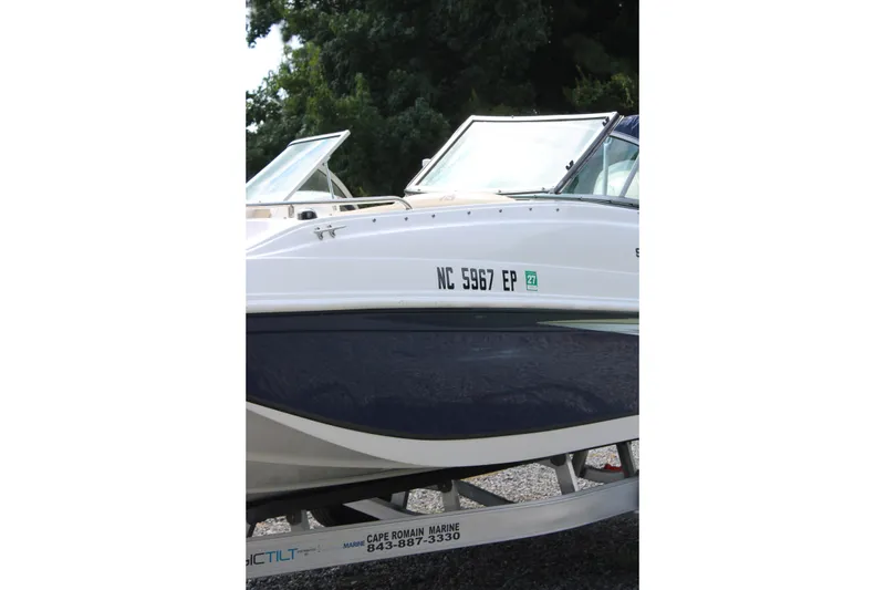 Slide: The Image of 2020 Hurricane SunDeck 187 OB boat on trailer, side view with registration number. - 14
