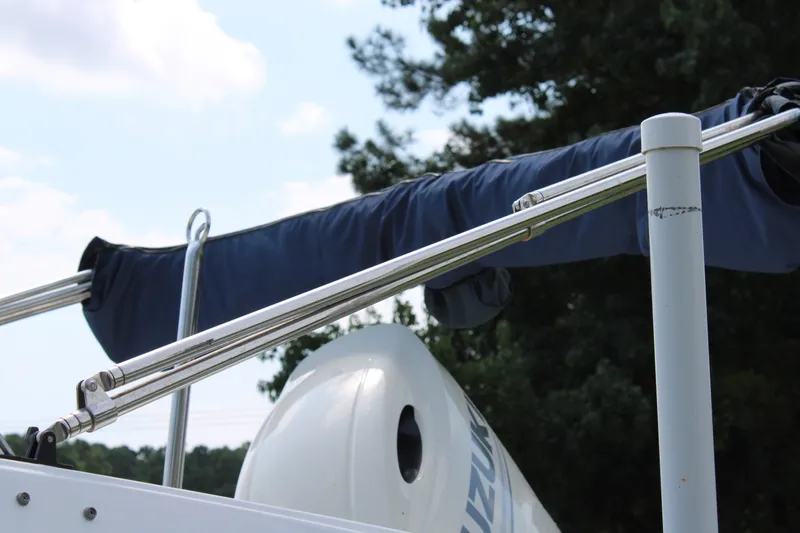 Slide: The Image of 2020 Hurricane SunDeck 187 OB boat with covered bimini top and Suzuki outboard motor. - 18