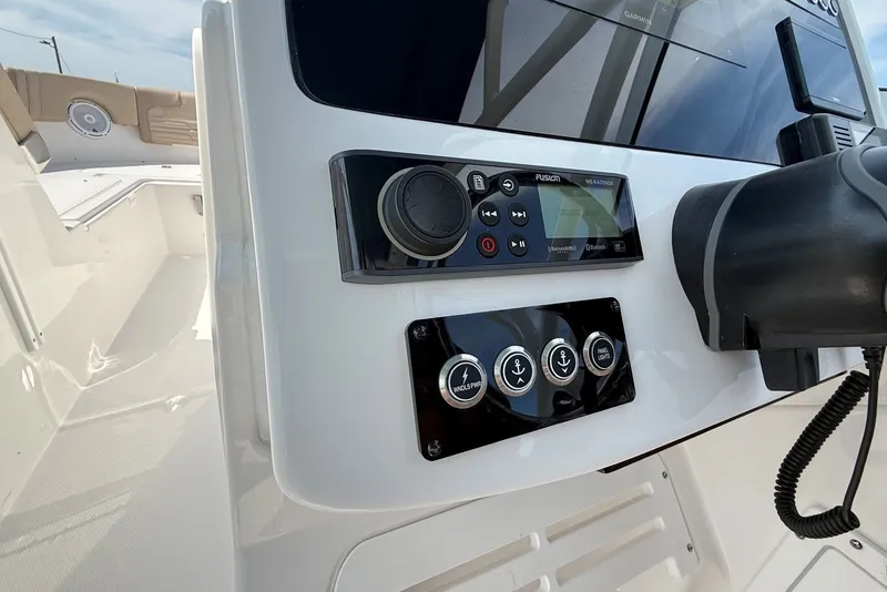 Slide: The Image of 2025 Edgewater 248CX Crossover boat dashboard with control panel and navigation system. - 24