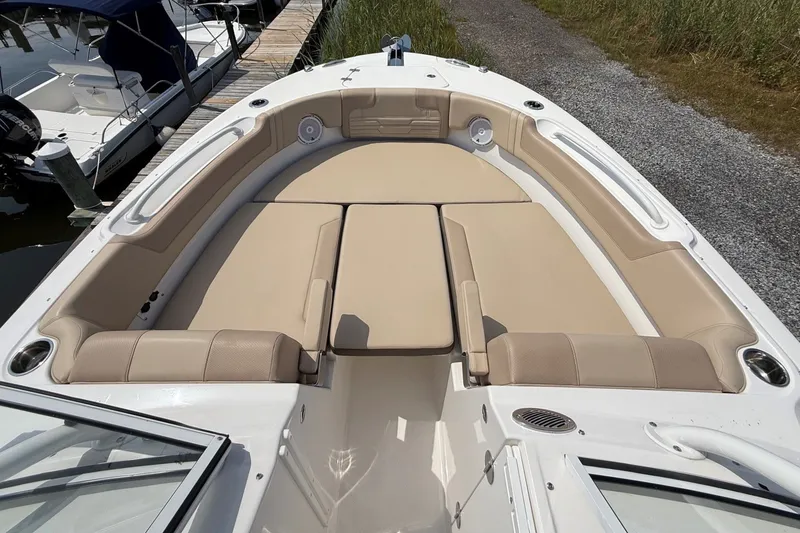 Slide: The Image of 2025 Edgewater 248CX Crossover boat with spacious beige seating and sleek design. - 29
