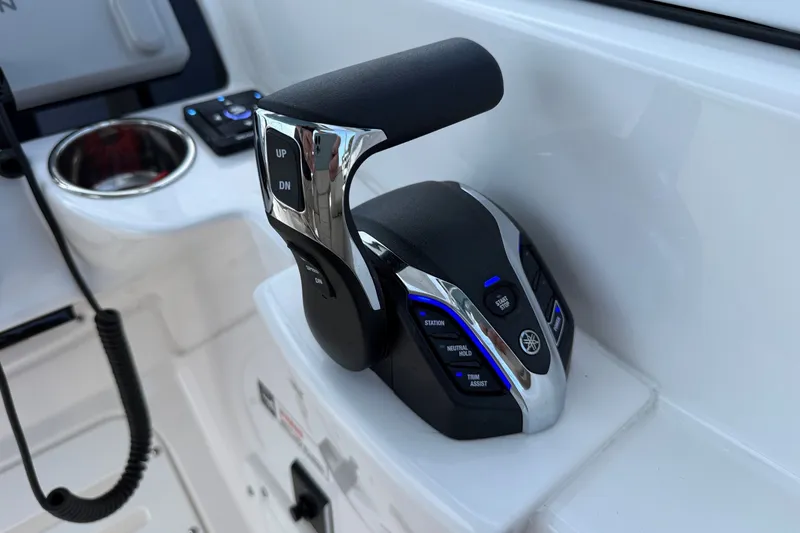Slide: The Image of Throttle control of 2025 Edgewater 248CX Crossover boat, featuring modern design and functionality. - 21