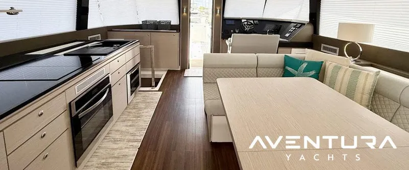 Slide: The Image of Luxurious interior of 2025 Aventura 56 Motor Yacht with modern kitchen and seating area. - 4
