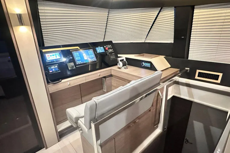 Slide: The Image of Modern helm station of 2026 Aventura 56 Motor Yacht with advanced navigation displays. - 12