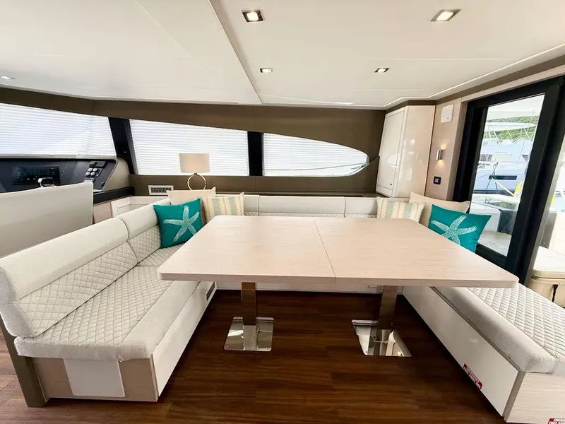 Slide: The Image of Luxurious interior of 2025 Aventura 56 Motor Yacht with elegant seating and modern decor. - 9
