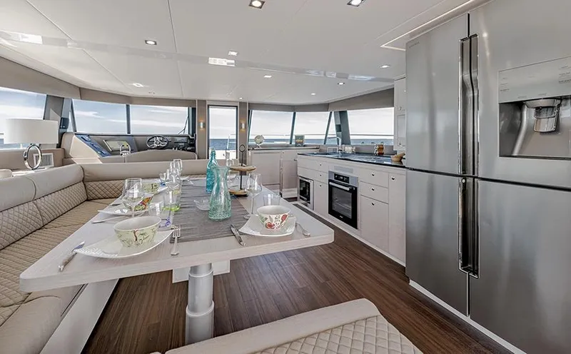 Slide: The Image of Luxurious interior of 2025 Aventura 56 Motor Yacht with modern kitchen and dining area. - 5