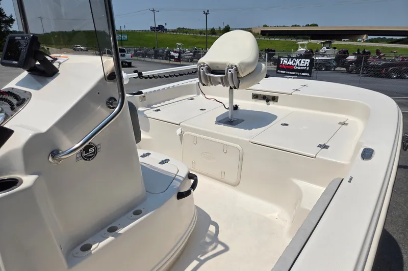 Slide: The Image of 2024 Carolina Skiff 19 LS boat interior with seating and storage compartments. - 7
