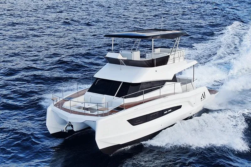 Slide: The Image of 2026 Aventura 38 Motor Yacht cruising on open sea, showcasing sleek design and luxury. - 8