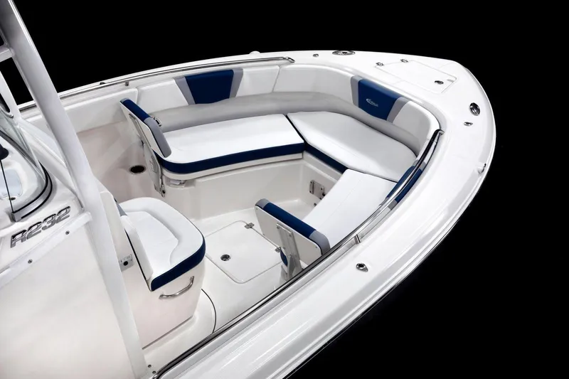 Slide: The Image of Manufacturer Provided Image: 2026 Robalo R232 Explorer boat interior with white and blue seating. - 7