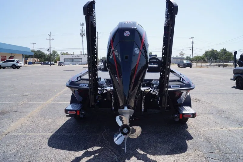 Slide: The Image of Rear view of a 2027 Phoenix 921 Elite X boat in a parking lot. - 13