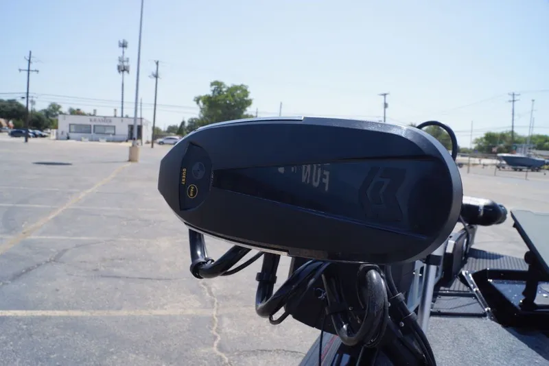 Slide: The Image of Close-up of a 2027 Phoenix 921 Elite X boat motor in a parking lot. - 17