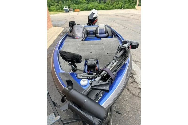 Slide: The Image of 2014 Skeeter TZX195 bass boat with trolling motor and spacious deck. - 6