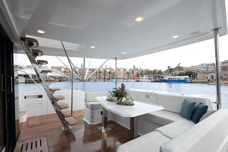 Slide: The Image of Luxurious 2026 Aventura 38 Motor Yacht with elegant deck seating and scenic harbor view. - 13