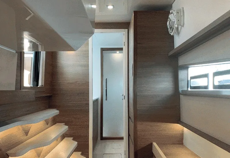 Slide: The Image of Interior of 2025 Aventura 38 Sport Coupe, featuring modern wood paneling and sleek design. - 21
