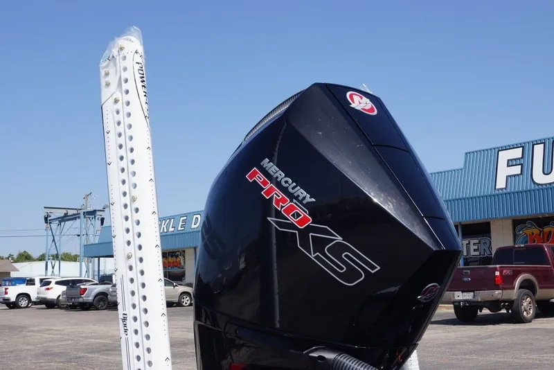Slide: The Image of Mercury Pro XS engine on Phoenix 21 XE, 2027 model, in dealership parking lot. - 14