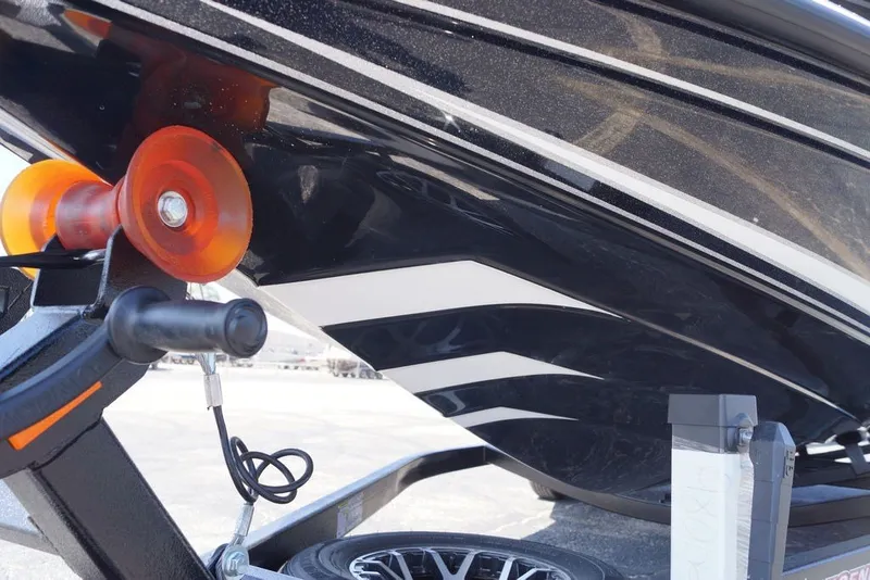 Slide: The Image of Close-up of a 2027 Phoenix 21 XE boat hull on a trailer. - 18
