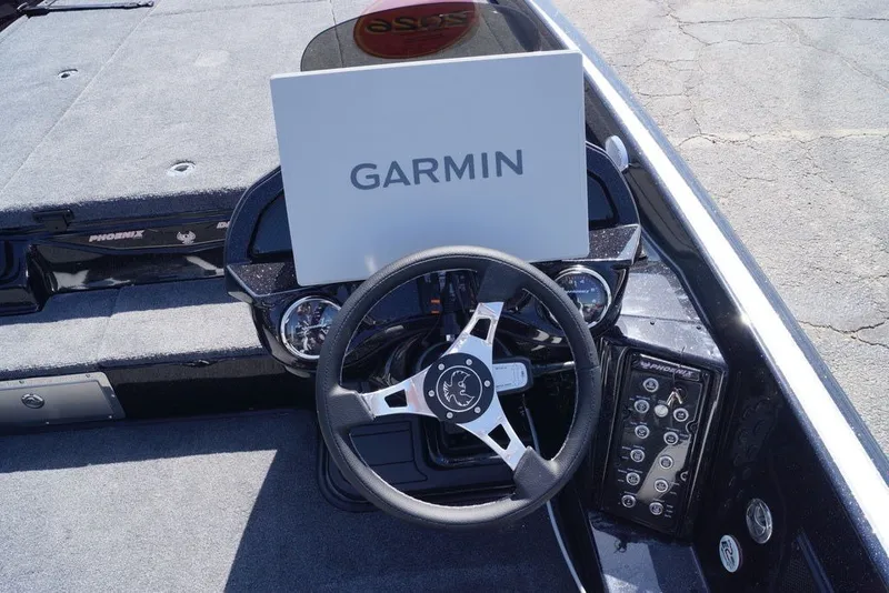 Slide: The Image of Steering console of 2027 Phoenix 21 XE boat with Garmin navigation system. - 17