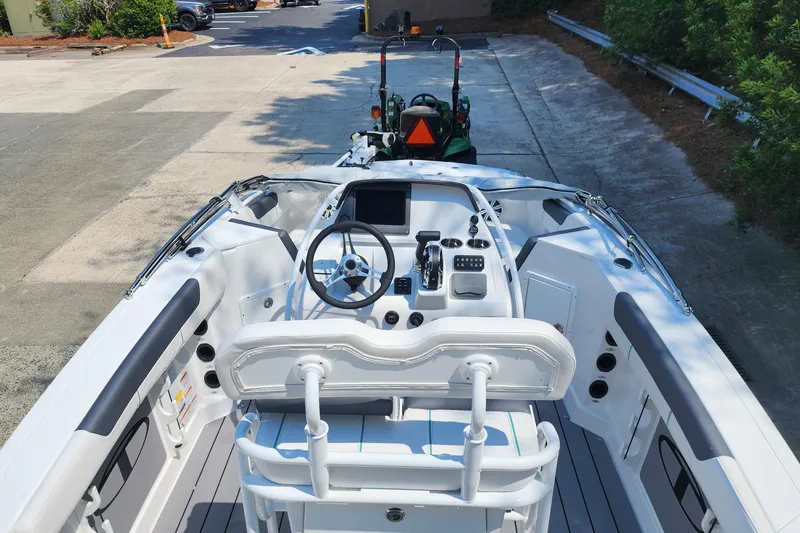 Slide: The Image of 2026 Tahoe 2150 CC boat interior with steering wheel and control panel. - 8
