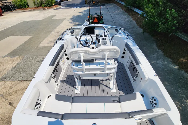 Slide: The Image of 2026 Tahoe 2150 CC boat interior with modern seating and steering console. - 7