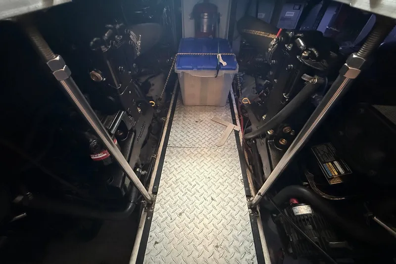 Slide: The Image of Engine room of a 2000 Carver 396 Motor Yacht with visible machinery and storage. - 37