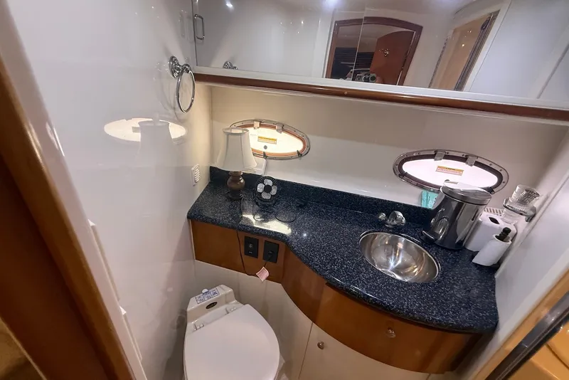 Slide: The Image of Luxurious bathroom in 2000 Carver 396 Motor Yacht with modern amenities and sleek design. - 30