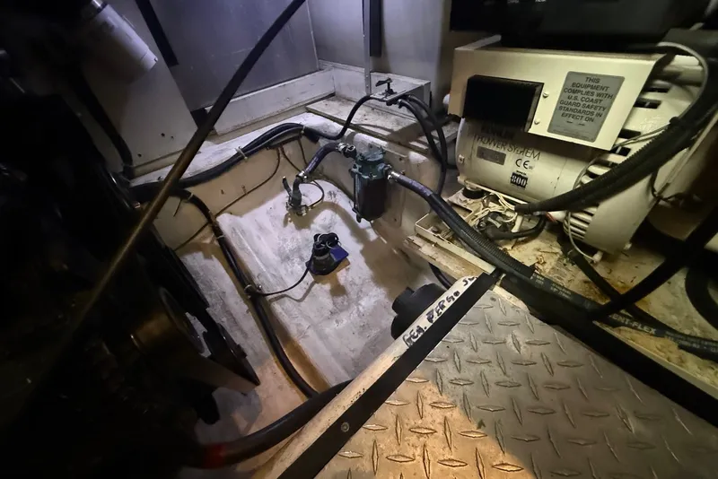 Slide: The Image of Engine room of a 2000 Carver 396 Motor Yacht, showing mechanical components and wiring. - 36
