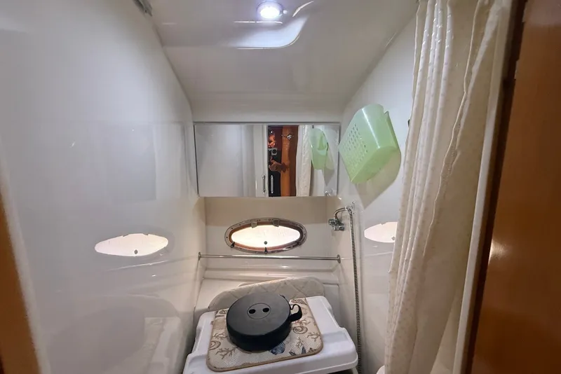 Slide: The Image of Bathroom interior of 2000 Carver 396 Motor Yacht with shower and storage. - 24