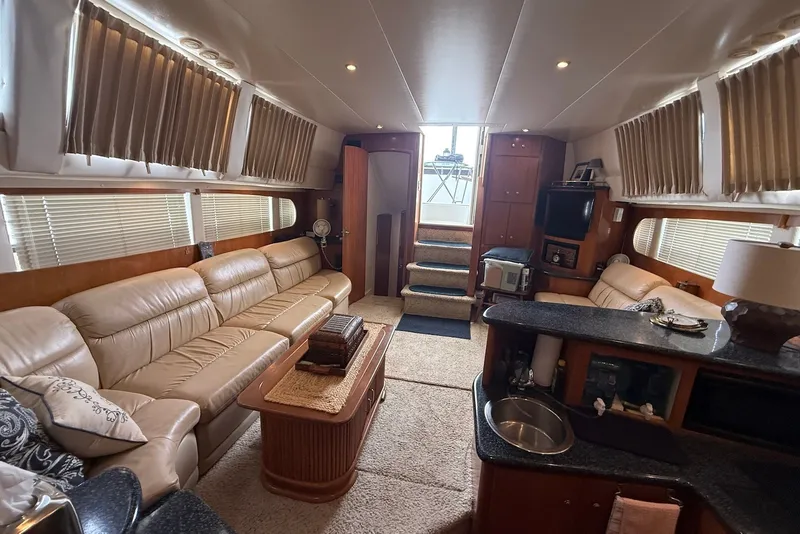 Slide: The Image of Luxurious interior of a 2000 Carver 396 Motor Yacht with plush seating and elegant decor. - 18