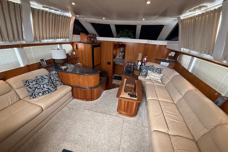 Slide: The Image of Luxurious interior of 2000 Carver 396 Motor Yacht with plush seating and elegant decor. - 17
