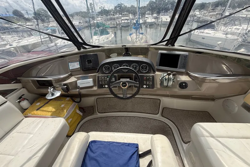 Slide: The Image of Interior helm of 2000 Carver 396 Motor Yacht with steering wheel and controls. - 13