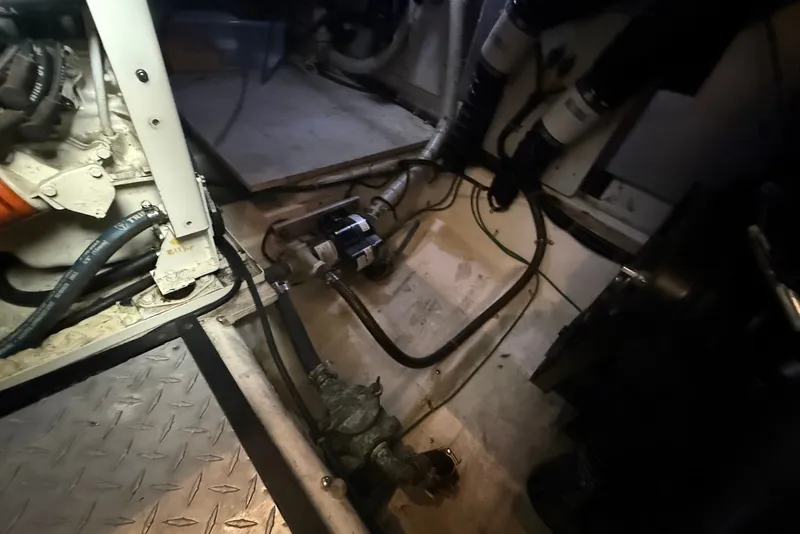 Slide: The Image of Engine room of a 2000 Carver 396 Motor Yacht with visible mechanical components. - 35