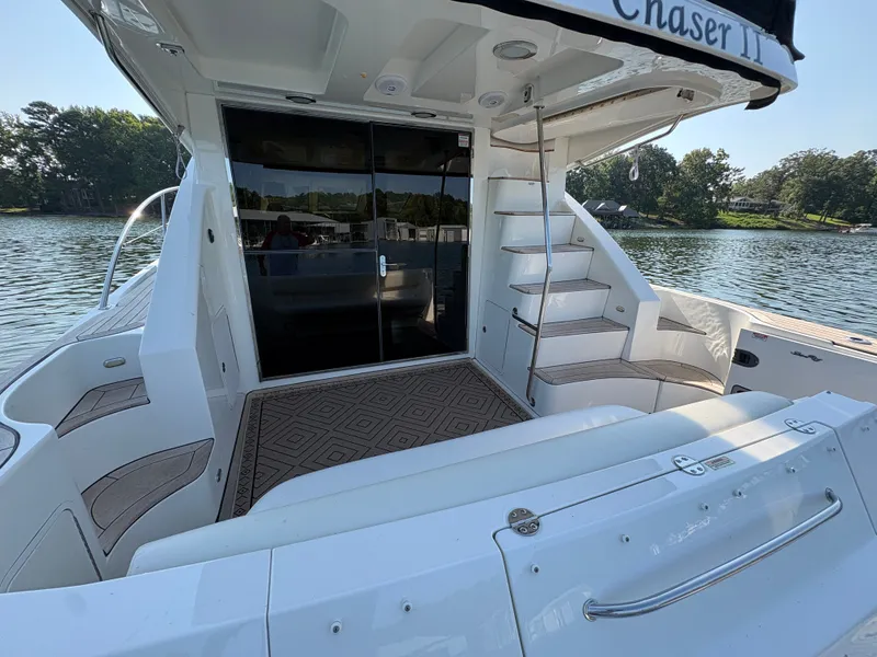 Slide: The Image of The 2008 Sea Ray 47 Sedan Bridge features a spacious aft deck with stairs and sliding glass doors. - 31
