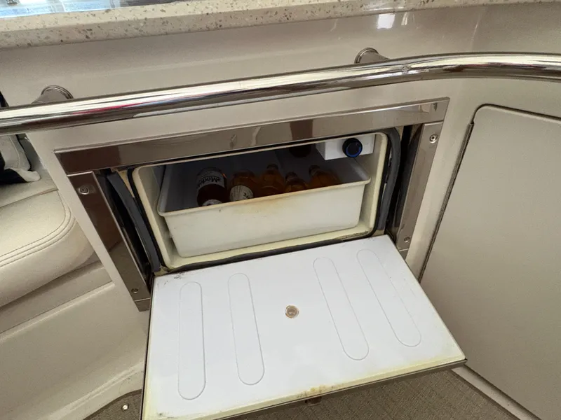 Slide: The Image of An open fridge on a 2008 Sea Ray 47 Sedan Bridge with drinks inside. - 12