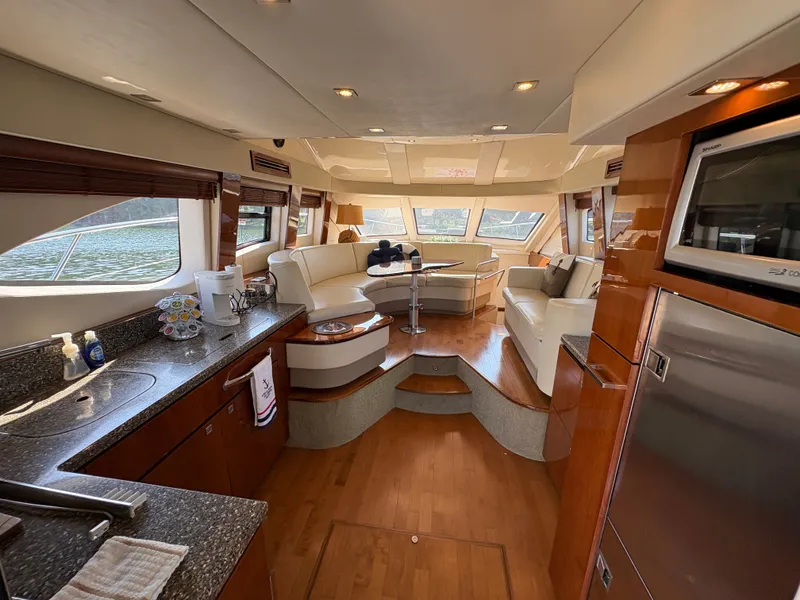 Slide: The Image of Interior of a 2008 Sea Ray 47 Sedan Bridge with elegant kitchen and cozy living area. - 34