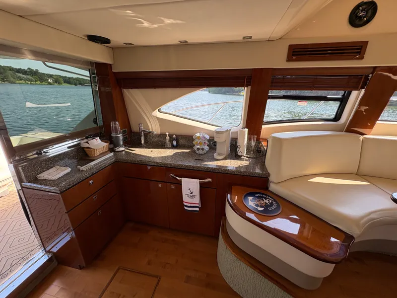 Slide: The Image of Interior of a 2008 Sea Ray 47 Sedan Bridge with elegant kitchen and seating area. - 39
