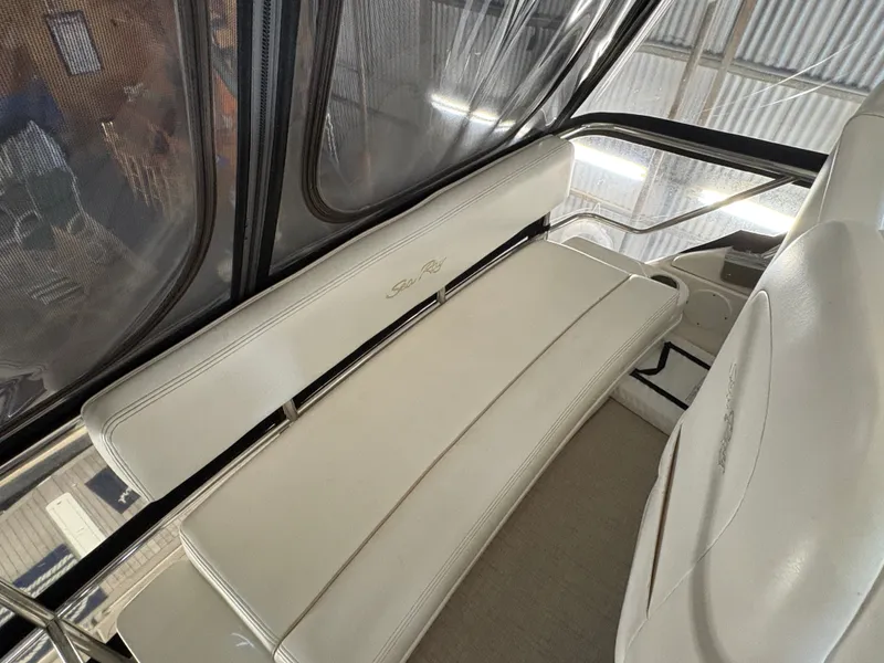 Slide: The Image of Interior view of a 2008 Sea Ray 47 Sedan Bridge with white leather seating. - 14