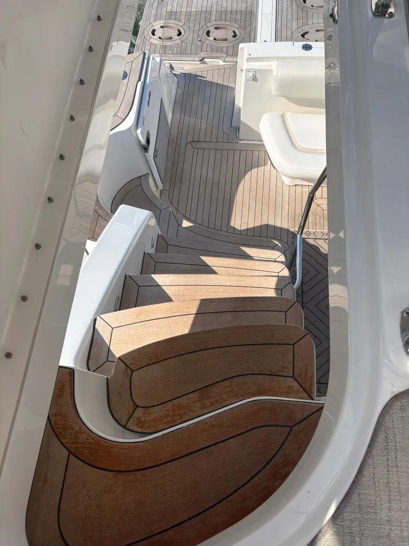 Slide: The Image of Staircase on a 2008 Sea Ray 47 Sedan Bridge yacht with wood-like finish. - 30