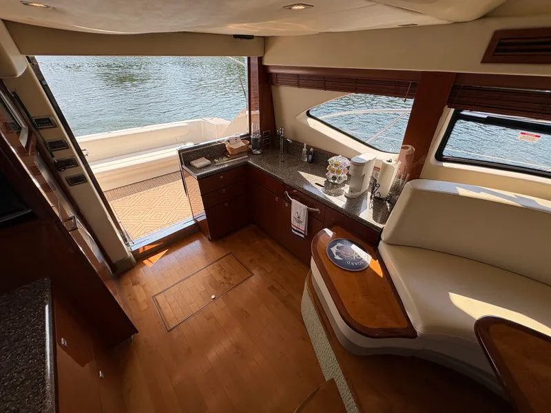 Slide: The Image of Interior of a 2008 Sea Ray 47 Sedan Bridge with elegant kitchen and water view. - 33