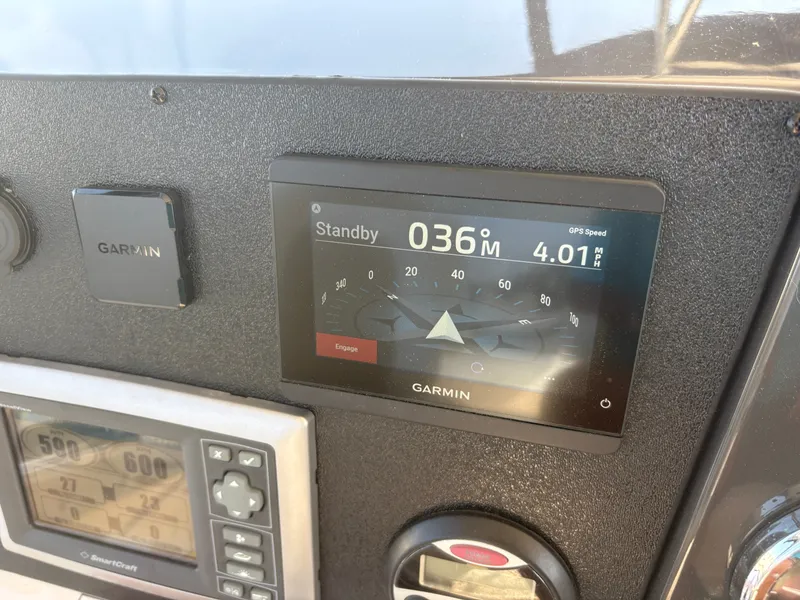 Slide: The Image of A Garmin navigation system on a 2008 Sea Ray 47 Sedan Bridge displays course and speed. - 23