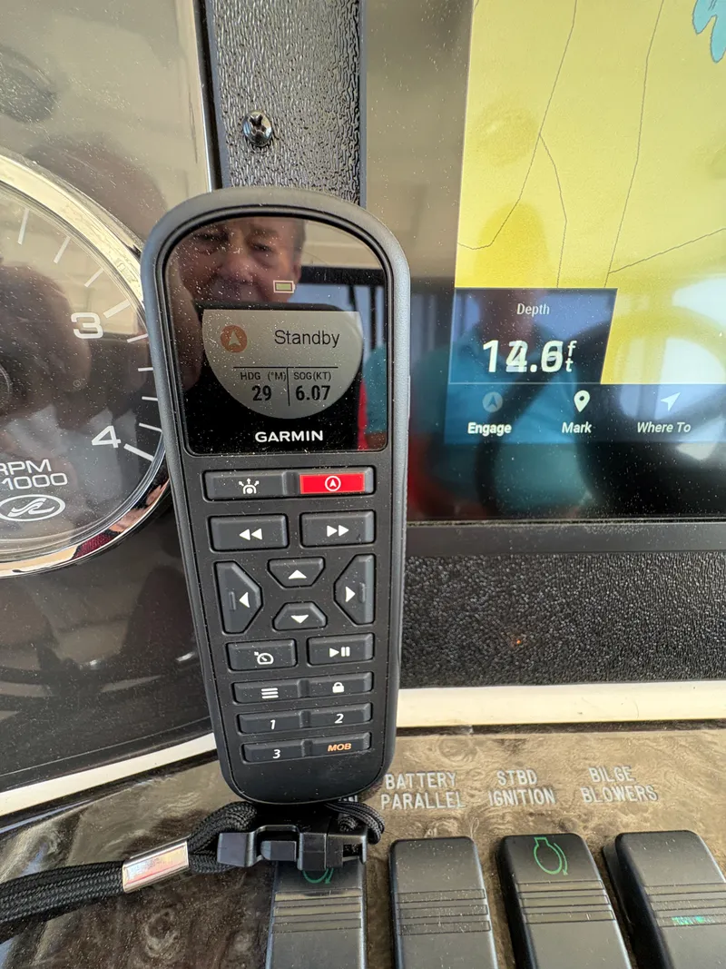Slide: The Image of Garmin remote on the dashboard of a 2008 Sea Ray 47 Sedan Bridge. - 29
