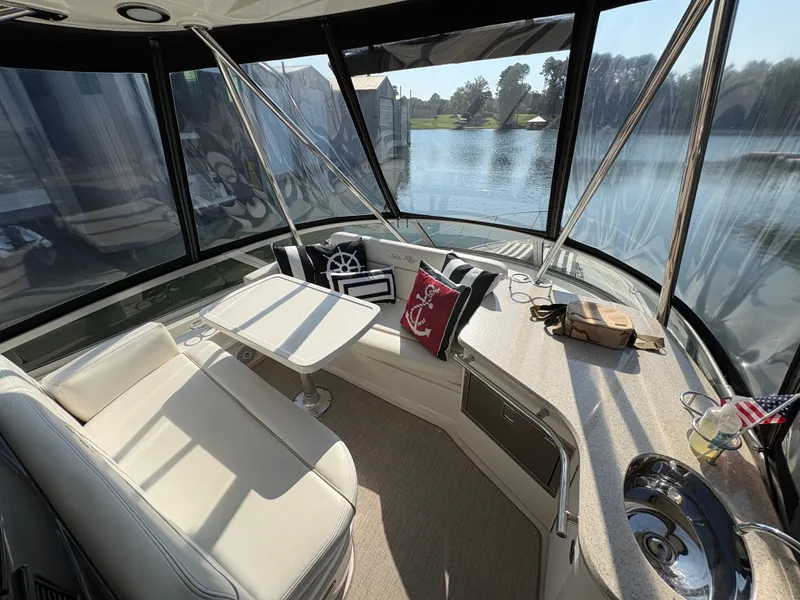 Slide: The Image of Interior of a 2008 Sea Ray 47 Sedan Bridge with comfortable seating and a view of the water. - 20