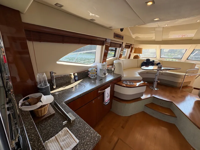 Slide: The Image of Interior of a 2008 Sea Ray 47 Sedan Bridge with elegant kitchen and cozy seating area. - 35