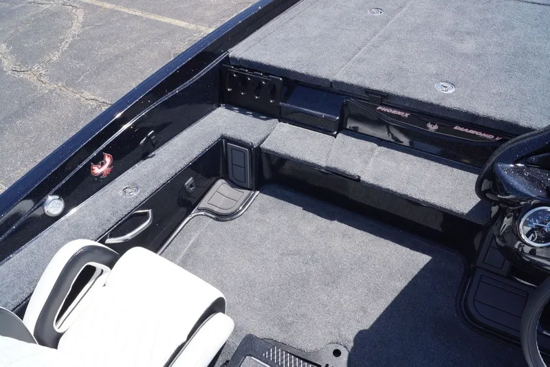 Slide: The Image of Interior of 2027 Phoenix 720 ZXL boat with gray carpet and seating. - 9