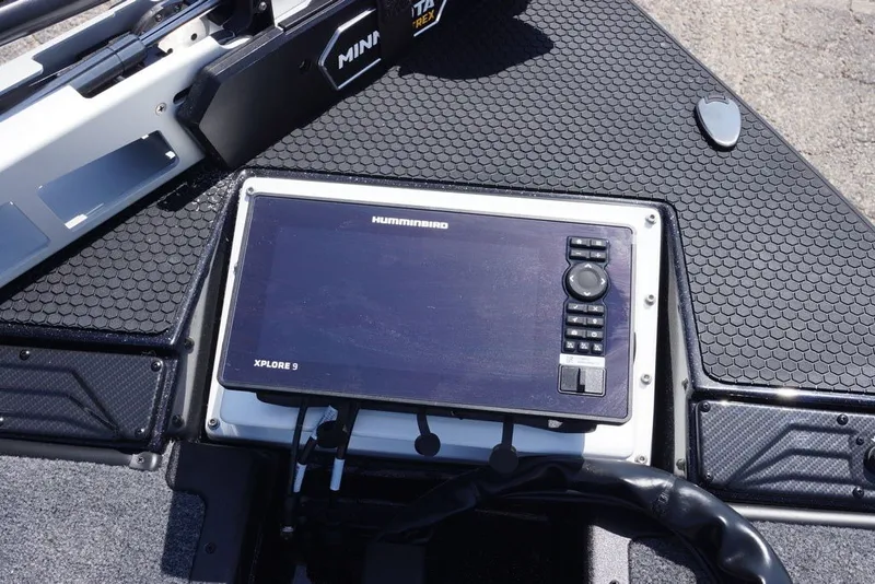 Slide: The Image of Dashboard of a 2027 Phoenix 720 ZXL boat with Humminbird Xplore 9 display. - 3