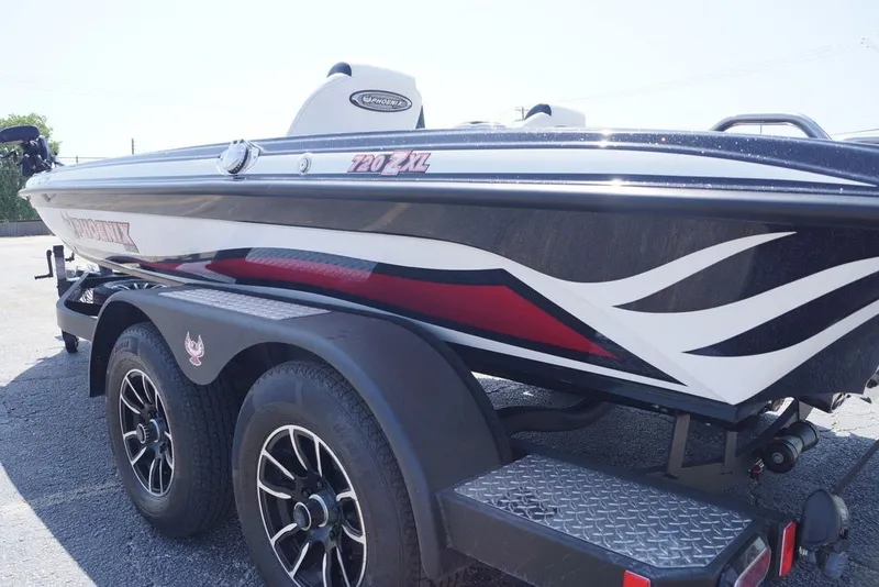 Slide: The Image of 2027 Phoenix 720 ZXL boat on trailer, featuring sleek design and modern graphics. - 1