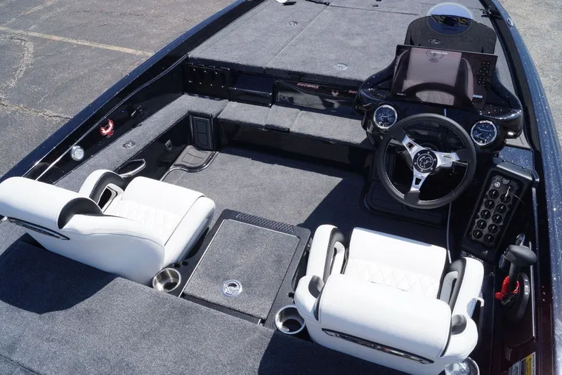 Slide: The Image of Interior of 2027 Phoenix 720 ZXL boat with modern dashboard and white seating. - 16