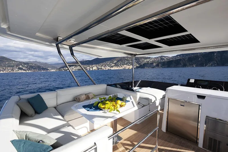Slide: The Image of Luxurious 2026 Aventura 38 Motor Yacht with elegant seating and scenic ocean view. - 6