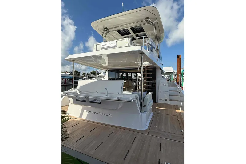 Slide: The Image of Aventura 38 Motor Yacht 2026 at dock, modern design. - 5