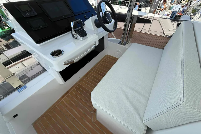 Slide: The Image of Helm station of 2026 Aventura 38 Motor Yacht with modern controls and seating. - 31